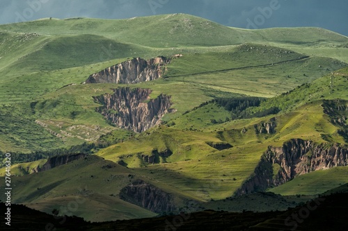 Stunning landscape near Goris city in Armenia. Green mountains and rocky cliffs in the sun after a storm. photo