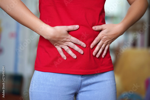 Woman having painful stomachache. Chronic gastritis. Body And Health Care Concept.