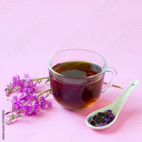 Useful herbal tea from fermented leaves fireweed on pink background