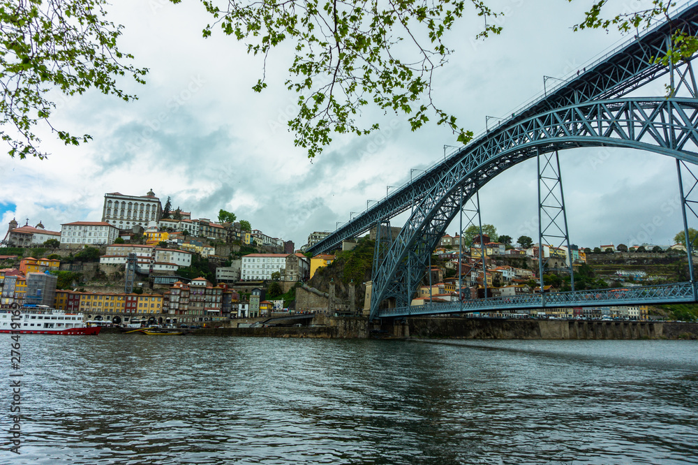 Porto cityscape on the Douro River and Dom Luis I Bridge.