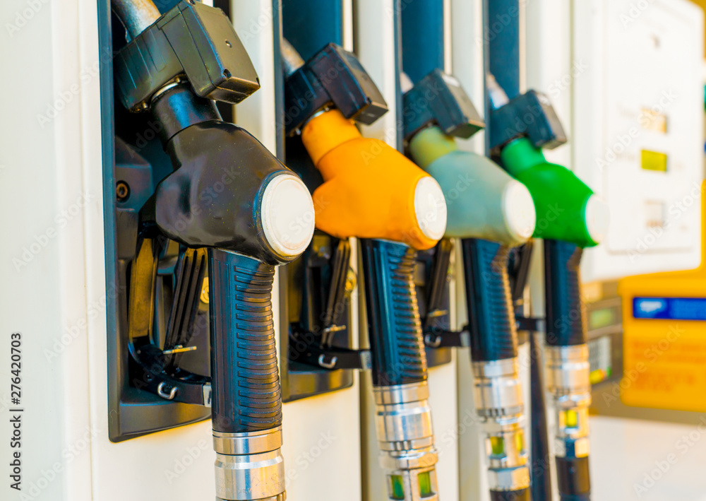 Gas station with four multi-colored handles close-up Gas station with four multi-colored handles close-up