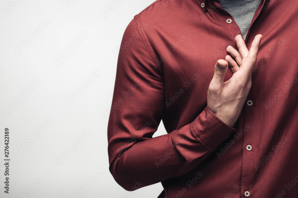 partial view of confident man gesturing with hand isolated on grey, human emotion and expression concept