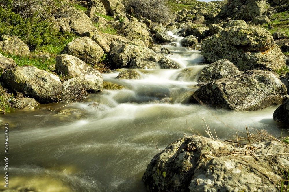 Waterfalls on a mountain stream. A delightful spring landscape. Mount Aragats. Armenia Waterfalls on a mountain stream. A delightful spring landscape. Mount Aragats. Armenia