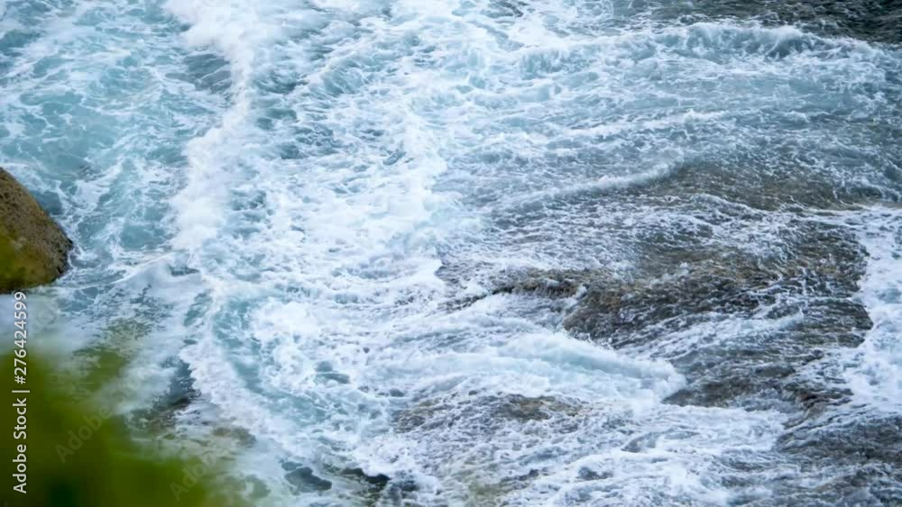 Coastal swells roll into the cliff face of an Australian coastline. SLOW MOTION Coastal swells roll into the cliff face of an Australian coastline. SLOW MOTION