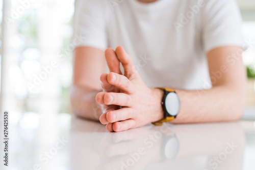 Close up young man hands together