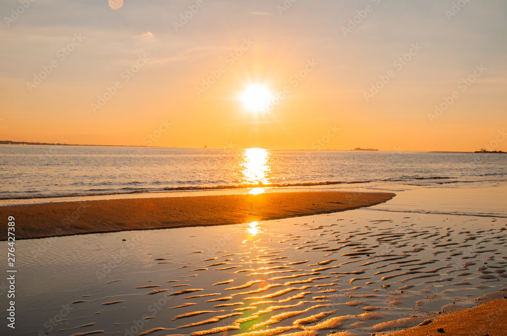 Obraz premium Sunset on the beach with beautiful sky. Beautiful blazing sunset landscape at sea