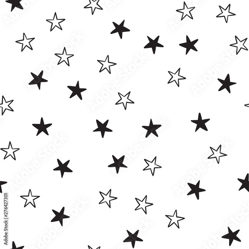 Star doodles seamless pattern. Hand drawn stars texture background. © Matias