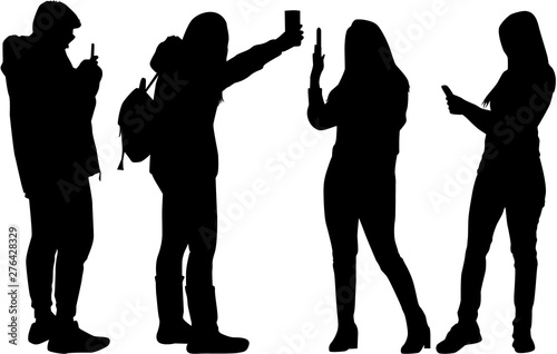 Silhouettes of people making photos.