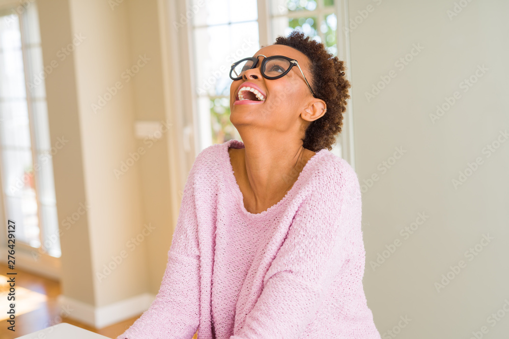 Beautiful young african woman with afro hair wearing glasses Beautiful young african woman with afro hair wearing glasses