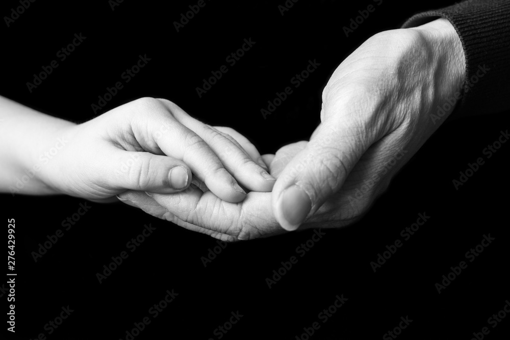 Child's hand in mother's hand Child's hand in mother's hand