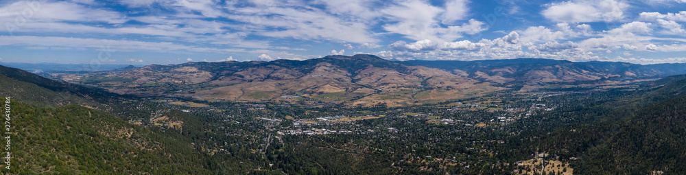 Seen from a bird's eye view forest covers the hills surrounding Ashland, a quaint city in southern Oregon. This area is known for mountain biking and the Oregon Shakespeare Festival.