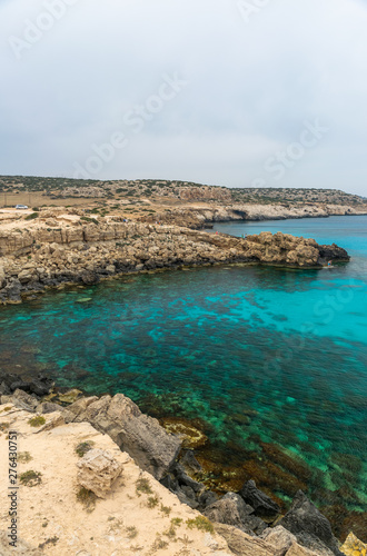CYPRUS, CAPE CAVO GRECO - MAY 11/2018: Tourists arrived by car to the blue lagoon for swimming.