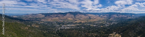 Seen from a bird's eye view forest covers the hills surrounding Ashland, a quaint city in southern Oregon. This area is known for mountain biking and the Oregon Shakespeare Festival. photo