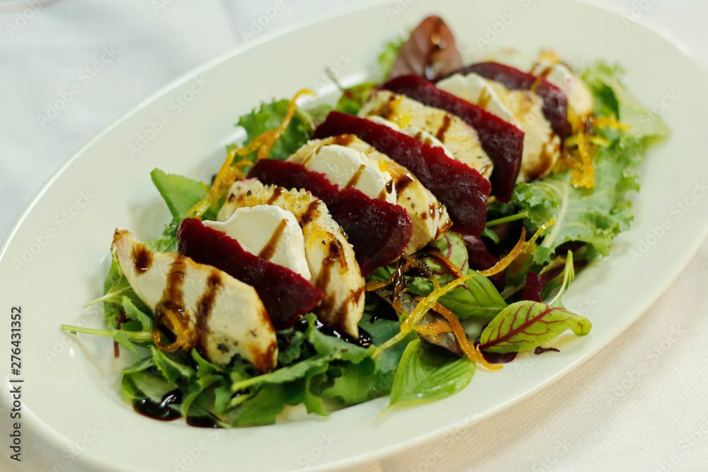 compound salad with chicken goats cheese and beetroot