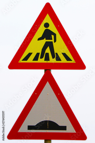 pedestrians walking along the road with bumb sign, yellow and red board with white background