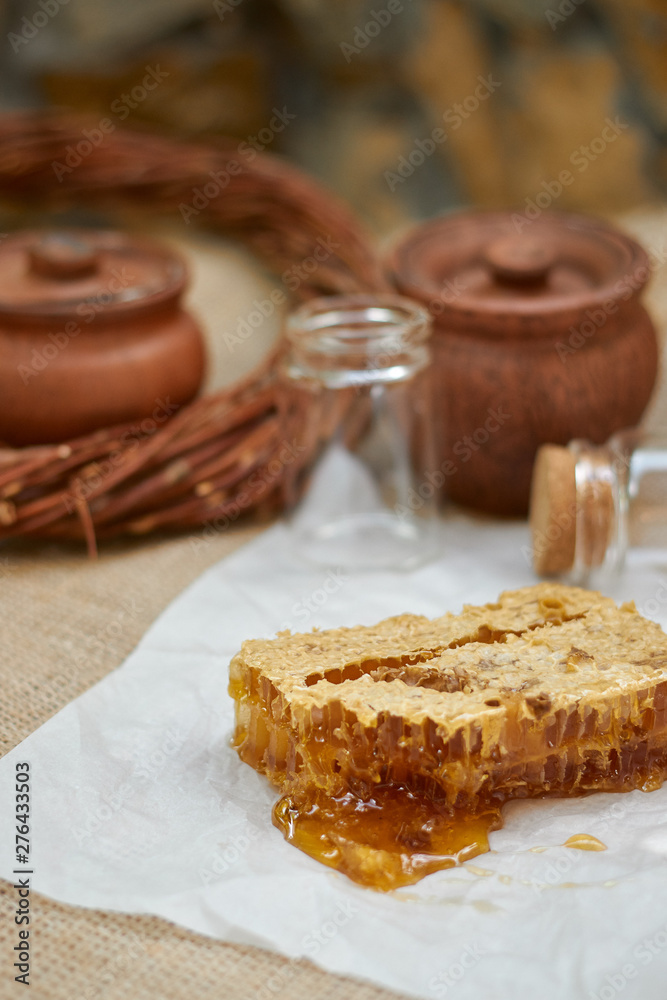 composition on a wicker table with honey comb composition on a wicker table with honey comb