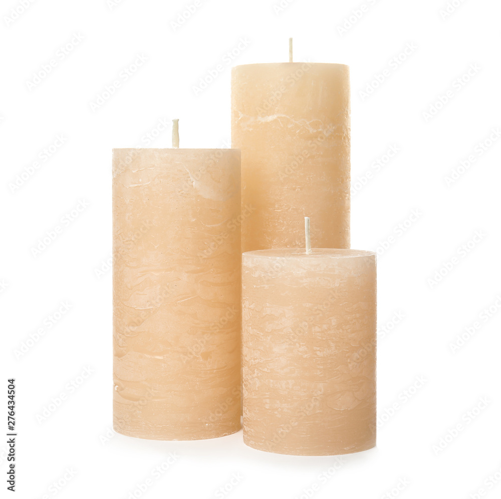 Three color wax candles on white background Three color wax candles on white background