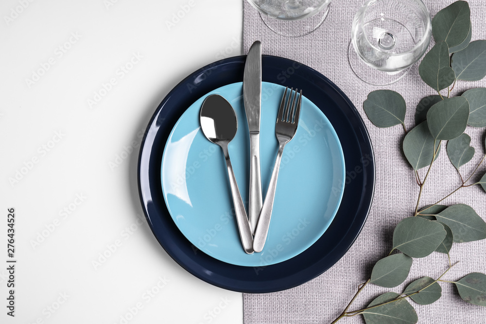 Stylish elegant table setting on white background, top view Stylish elegant table setting on white background, top view