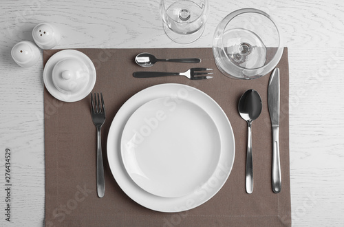 Stylish elegant table setting on white wooden background, top view