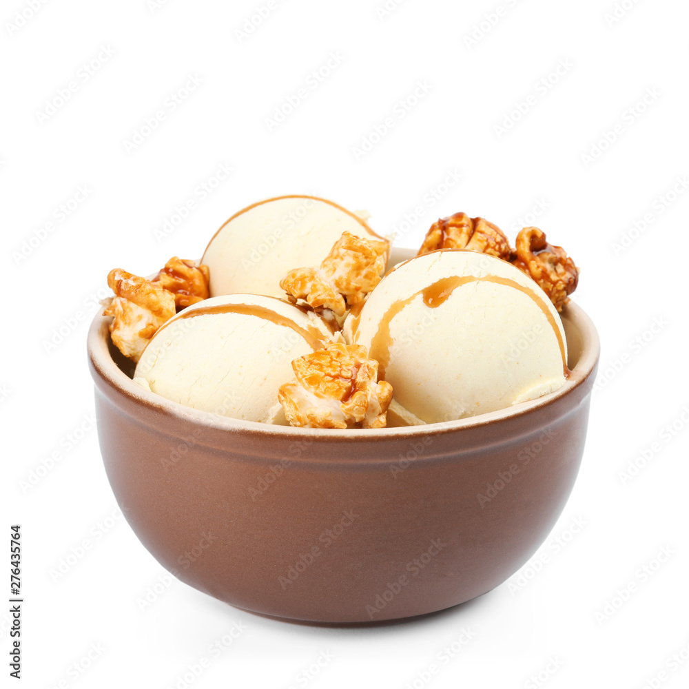 Delicious ice cream with caramel popcorn and sauce in bowl on white background