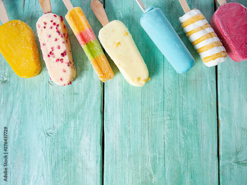 ice cream variety on a turquoise surface - obrazy, fototapety, plakaty 