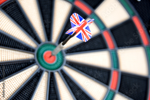 dart with great britain flag hitting bullseye