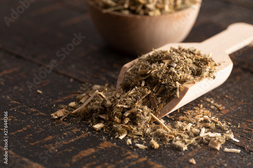 Pile of Dried Horehound on a Rustic Wooden Tabel photo