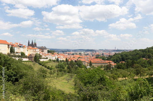 Summer Prague City with gothic Castle and the green Nature from the Hill Petrin, Czech Republic