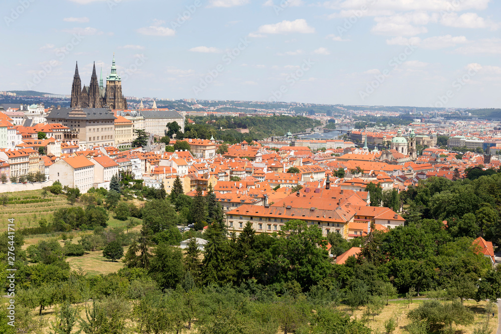 Summer Prague City with gothic Castle and the green Nature  from the Hill Petrin, Czech Republic