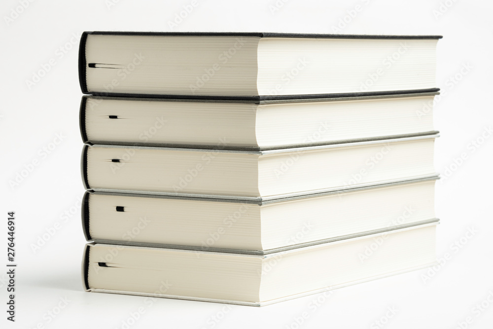 A Set Of Neatly Stacked Monochromatic Cloth Bound Books A Set Of Neatly Stacked Monochromatic Cloth Bound Books