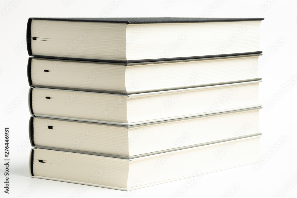 A Set Of Neatly Stacked Monochromatic Cloth Bound Books A Set Of Neatly Stacked Monochromatic Cloth Bound Books