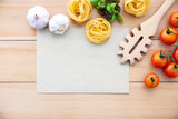 Italian foods concept and menu design . The ingredients for homemade pasta with copy space on wooden background.