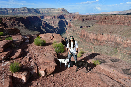 Canvas Print Young woman with her two dogs at Toroweap Overlook in Grand Canyon National Park, Arizona