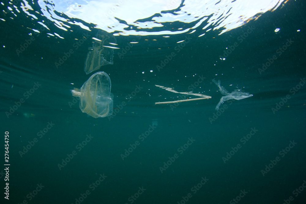 Plastic bags, bottles, cups and straws pollution in ocean - obrazy, fototapety, plakaty 