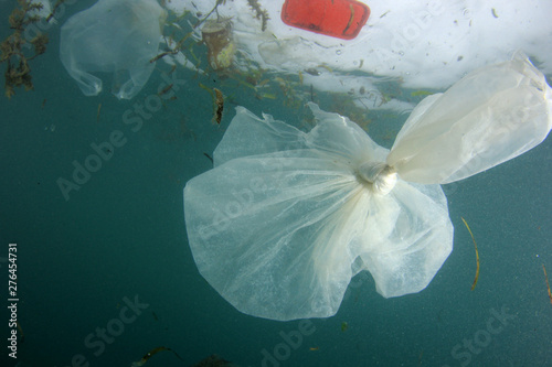 Fototapeta Naklejka Na Ścianę i Meble -  Plastic bags, bottles, cups and straws pollution in ocean