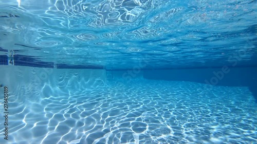 Slow motion view of underwater sunlight patterns in clean empty swimming pool.  Shot at 240 frames per second.  