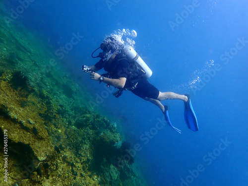 A scuba diver enjoy a leisure dive in Tunku Abdul Rahman Park, Kota Kinabalu. Sabah, Malaysia. Borneo. 