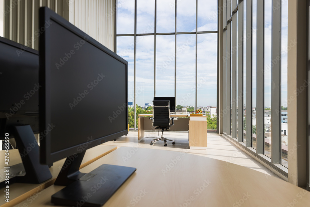 A wide-angle image of a modern office.. A wide-angle image of a modern office..