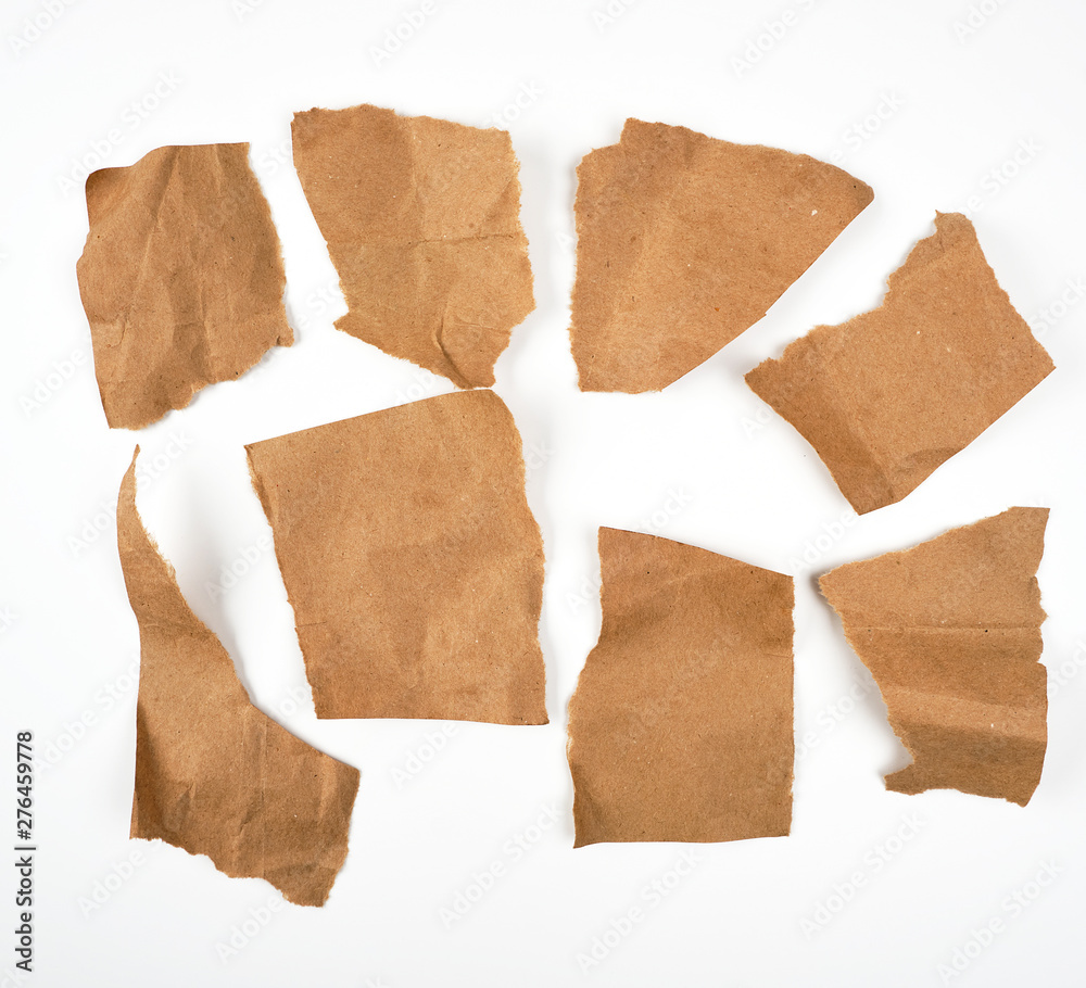 torn brown pieces of parchment paper