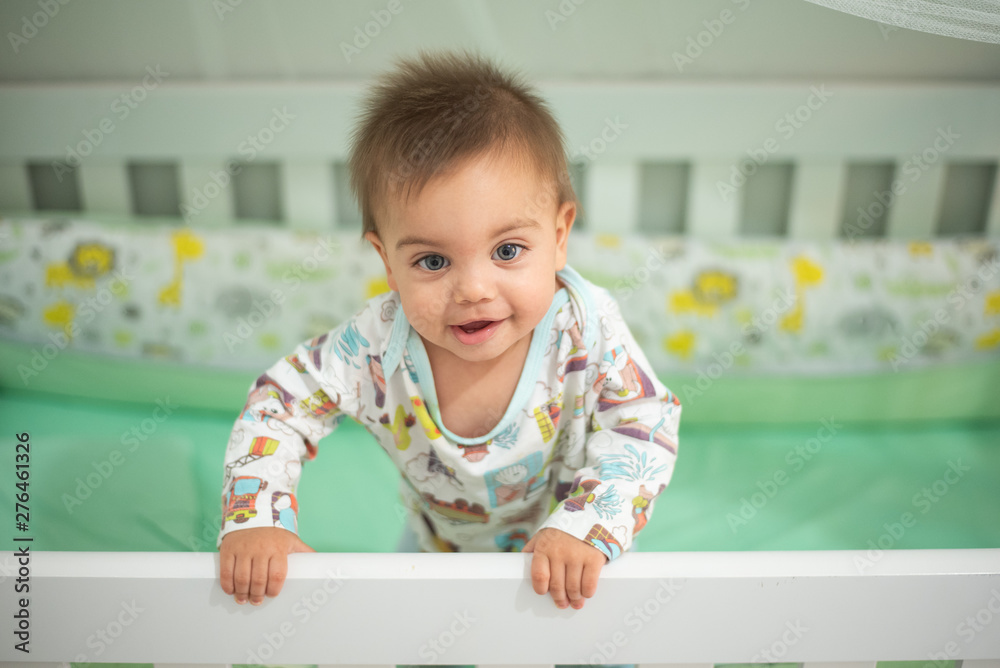Blue-eyed baby in crib Blue-eyed baby in crib
