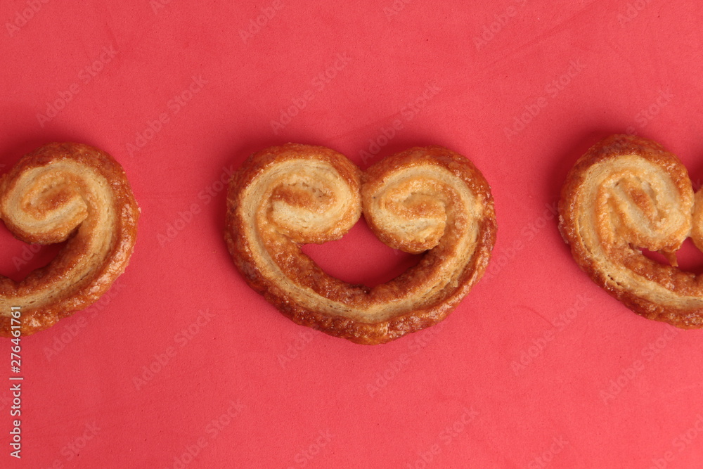 Puff pastry cookies on colorful background Puff pastry cookies on colorful background