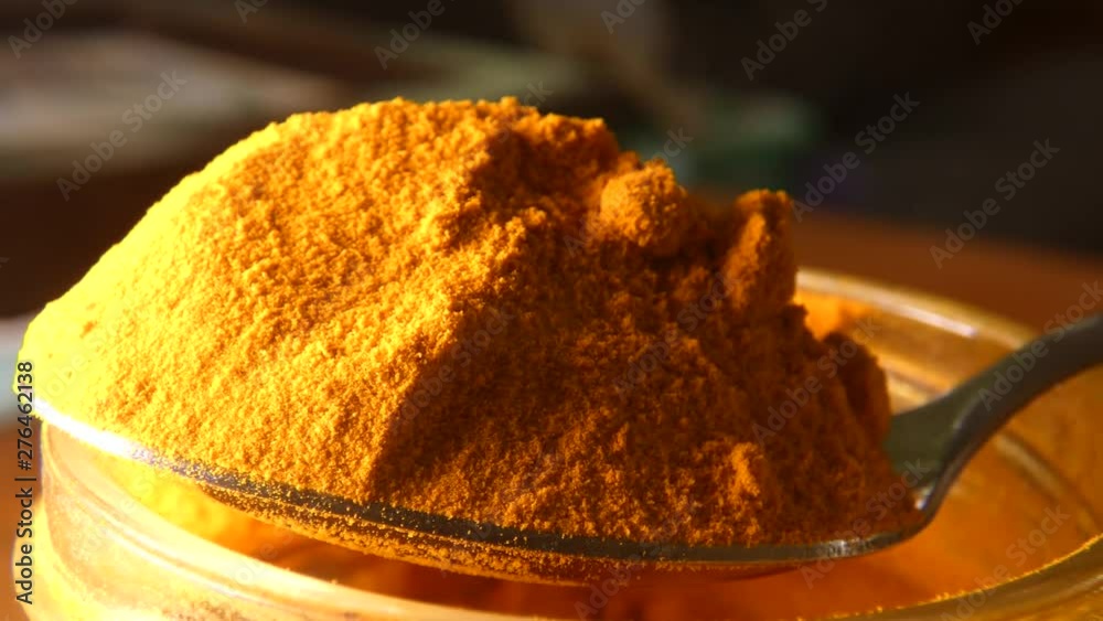 Full spoon of turmeric powder