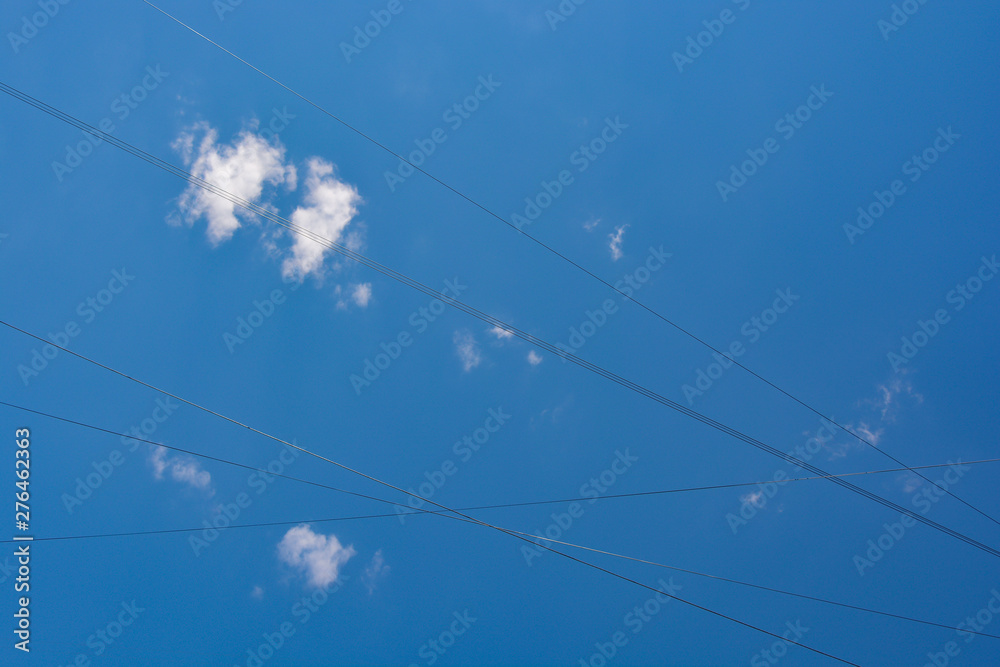 Fluffy white clouds on a blue sky background Fluffy white clouds on a blue sky background