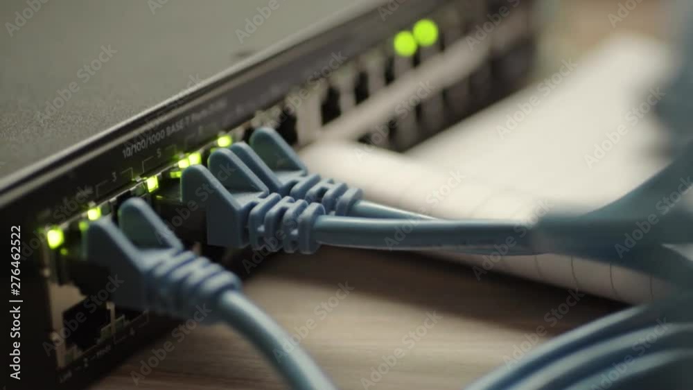 Network engineer working on Ethernet cable switch Network engineer working on Ethernet cable switch