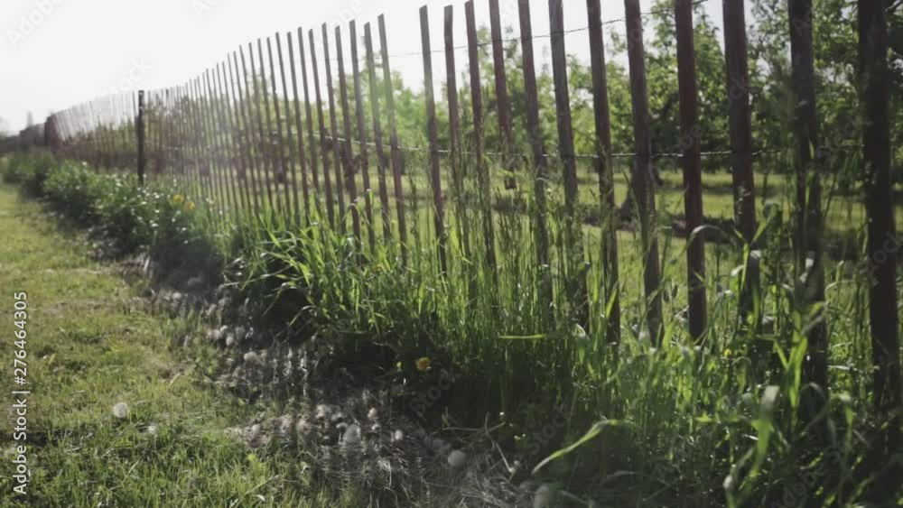 A fence on the countryside blows and shakes in the wind. A fence on the countryside blows and shakes in the wind.
