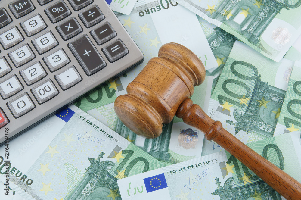 Judge gavel, calculator and euro banknotes