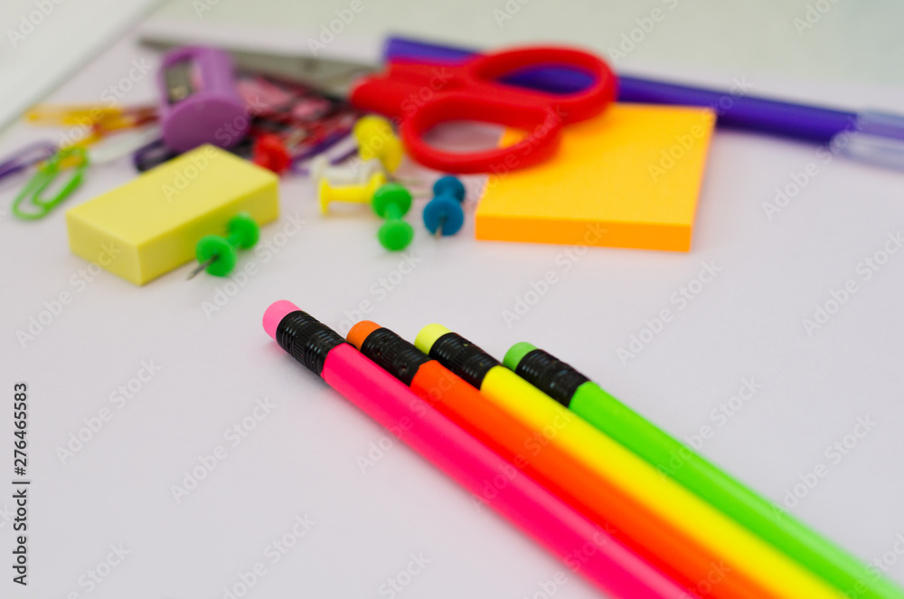 colored pencils with erasers and other stationery