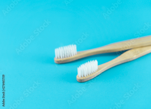 Close up wooden toothbrush on blue background  selective focus