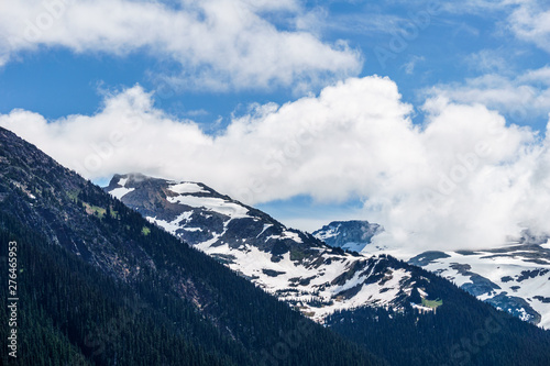 alpine landscape view from Garibaldi provincial park with peaks covered by snow and clouds. © olegmayorov