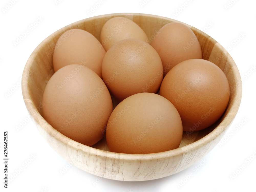 Raw fresh brown chicken eggs isolated on white background. Raw fresh brown chicken eggs isolated on white background.